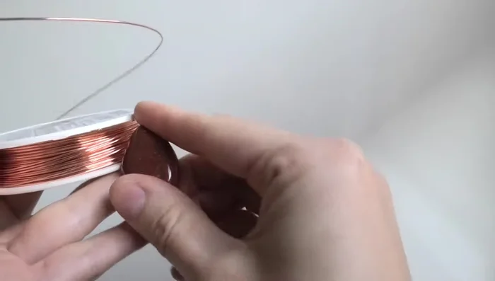 Find the middle of the wire and gently fold it in half.