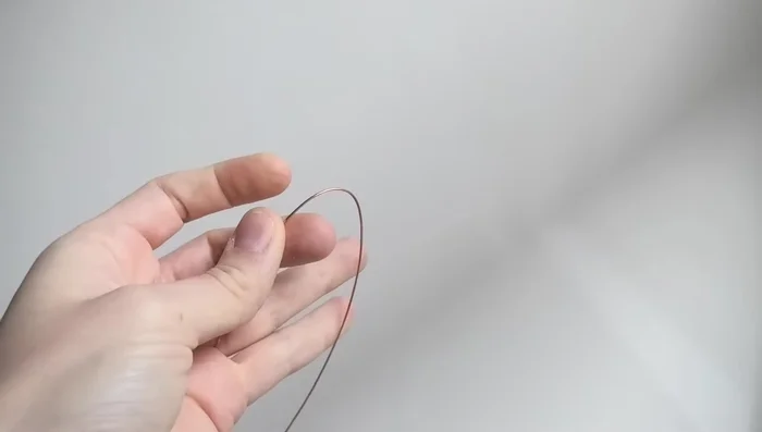 Find the middle of the wire and gently fold it in half.