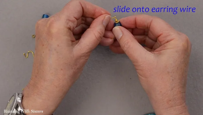 Slide the earring onto the earring wire and close the loop.