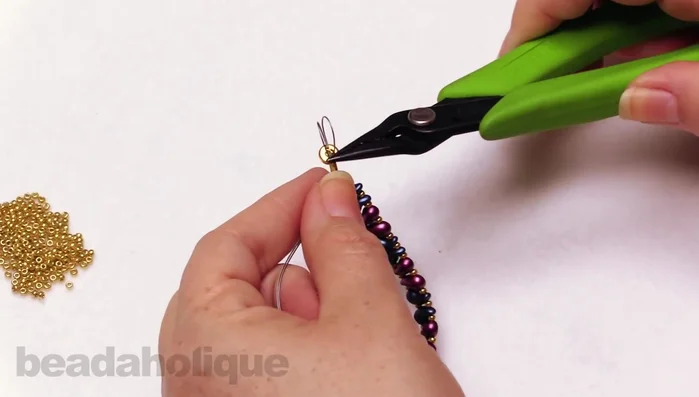 Crimp the tube securely. Trim excess wire. Add a crimp cover and crimp it closed.