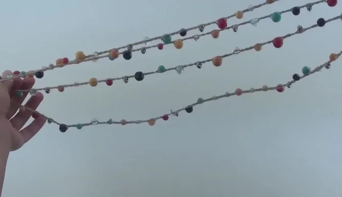 For a clasp, use either a round/oval clasp or a lobster clasp with jump rings. Attach the clasp(s) securely.