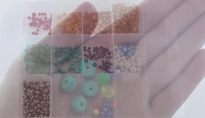 String beads onto crochet thread. Use nail polish to harden the thread ends for easier bead sliding.