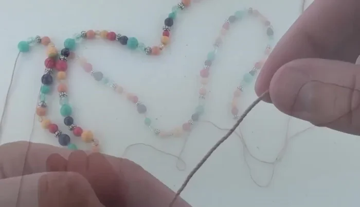 Make a slipknot and chain one. Slide the first bead up towards the hook.