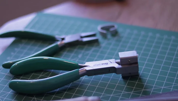 Bend the ring using pliers or a ring bending tool.