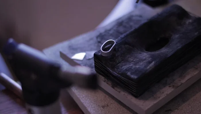 Solder the ring using hard solder and a soldering board.