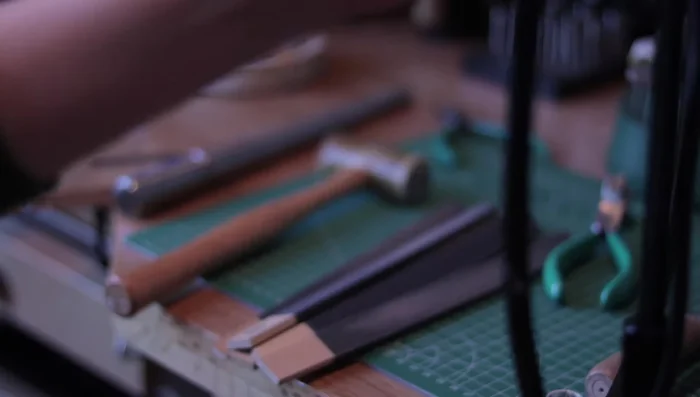 Sand and polish the ring using sanding sticks, buffing sticks, or a rotary tool.