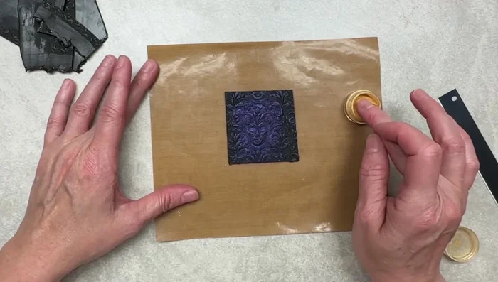 Apply gold M powder using fingers, gently brushing to avoid smudging.