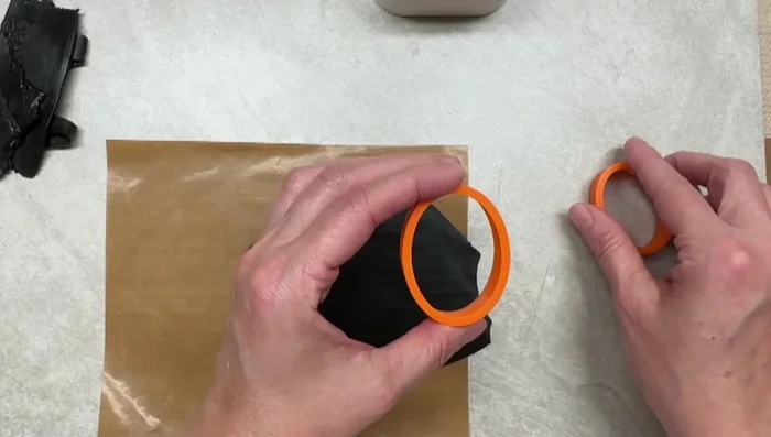 Attach the border piece to the main piece, using clay adhesive.