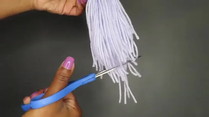Trim the excess tassel yarn.
