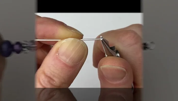 Use flat pliers to pinch the loop shut.