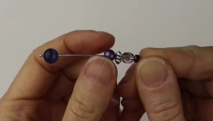 Use flat pliers to pinch the loop shut.