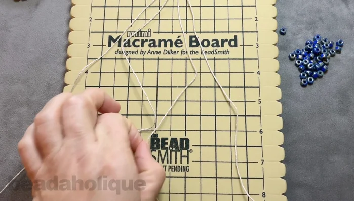 Separate the cords: two shorter cords in the center, two longer cords on the sides.