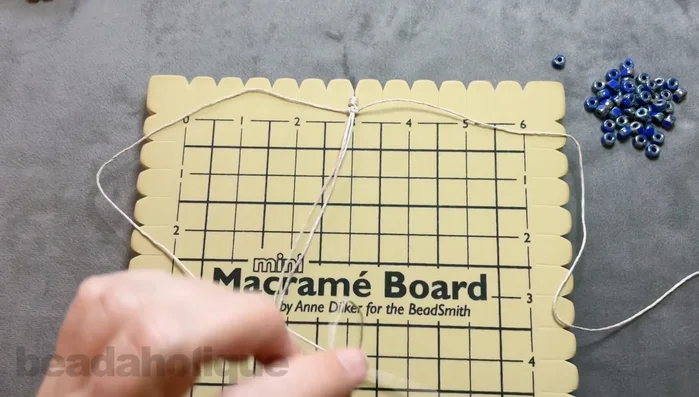 Slide a Matubo bead onto both cords and up to the knot. Repeat steps 5 and 6 until desired bracelet length is reached.