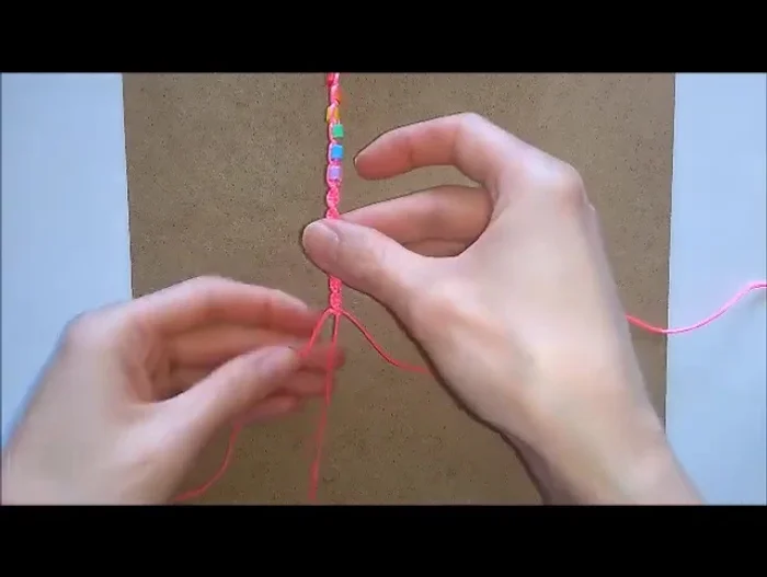 Tie a knot at the end, pull tight, and repeat on the other side. Trim excess and seal with a lighter or glue.