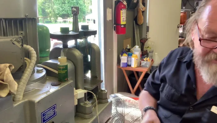 Square up ends and hammer texture: File the ends of the ingot to square them. Use a hammer to create the hammered texture on the surface of the ring.