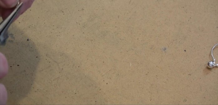 Finesse the earring and ear wire connections to ensure a secure and comfortable fit.