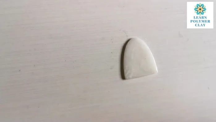 Use pan pastels (blue and purple) to color the clay, blending with fingers or a brush. Add unicorn purple metallic powder for sparkle.