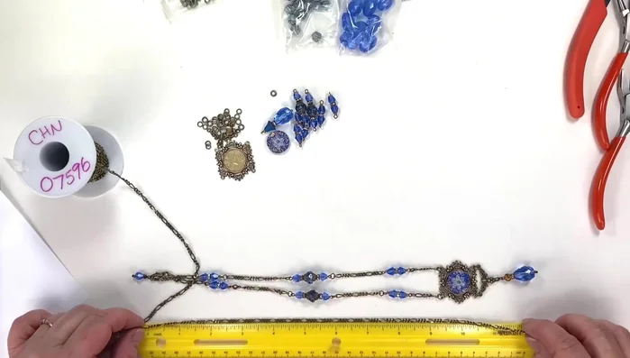 Prepare materials: Measure and cut the Figaro chain to the desired length (around 18-20 inches). Cut additional pieces of chain for the side accents (approximately 1.5 inches each, but adjust according to your preference).