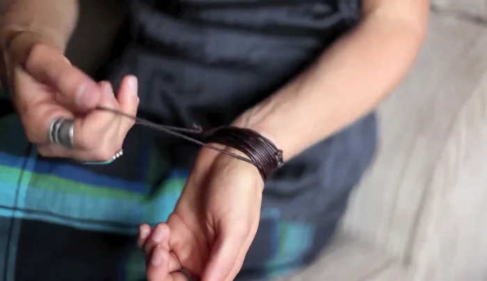 Final tightening: Adjust and tighten individual loops to even out the bracelet's fit against your wrist.