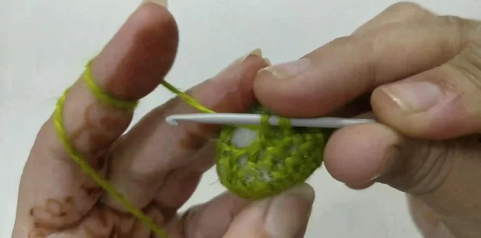 Round 9: Decrease stitches again (single crochet, single crochet) in each 2 stitches around to close the opening. Fasten off.