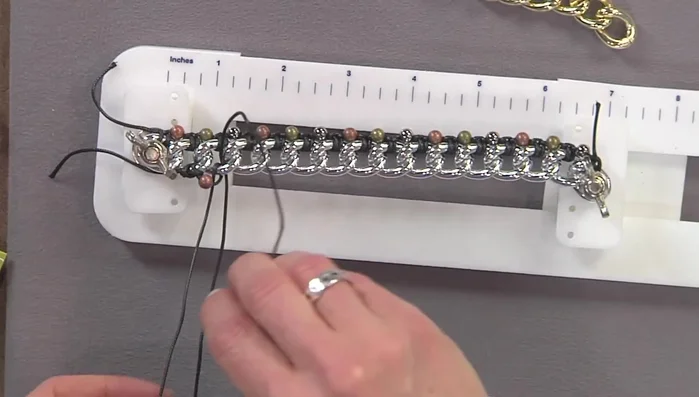 Continue the same knotting technique as before, adding beads between each knot.