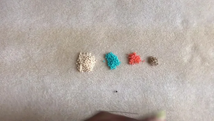 Prepare your thread: Cut 4-5 ft of Fireline and attach a stop bead.