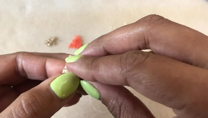 Close the ring: Use the up and down beads to connect the ends like a zipper. Weave the needle back and forth through the up beads in a zig-zag pattern to securely join the ends.