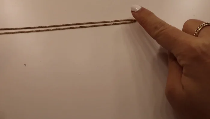 Attach charms to the chain using jump rings.