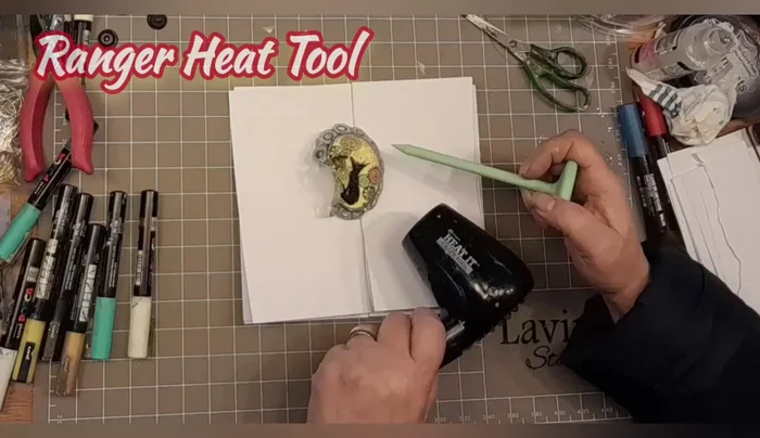 Apply glossy accents: Apply glossy accents to seal the design and add a brooch pin to the back.