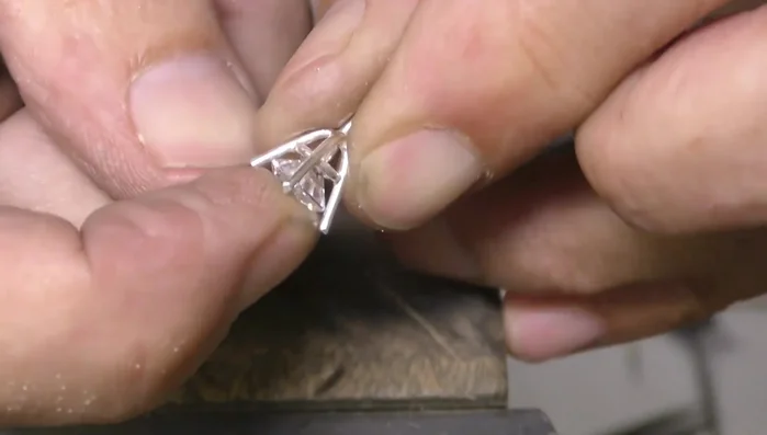 Set the stone, making adjustments to ensure a snug fit.