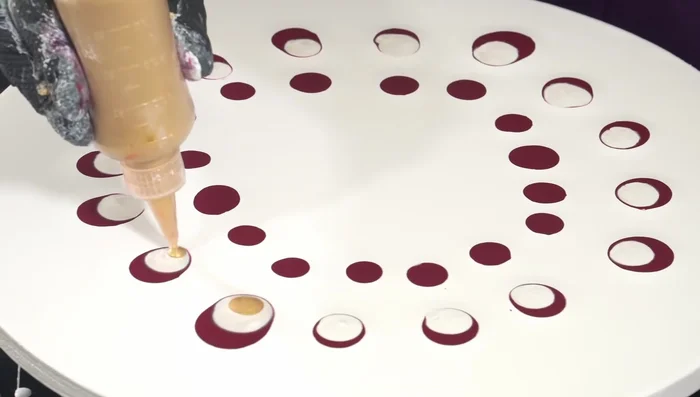 Add puddles of sparkly strawberry color (Quinacridone Crimson with gold and white).