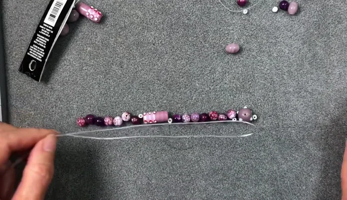 String Beads: Using the needle and fireline, string beads onto the cord. Ensure even color distribution if using varied beads.