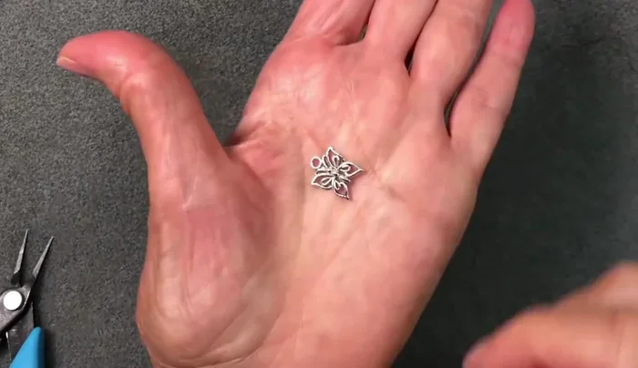 Add Charm (Optional): Attach a jump ring and charm, if desired.