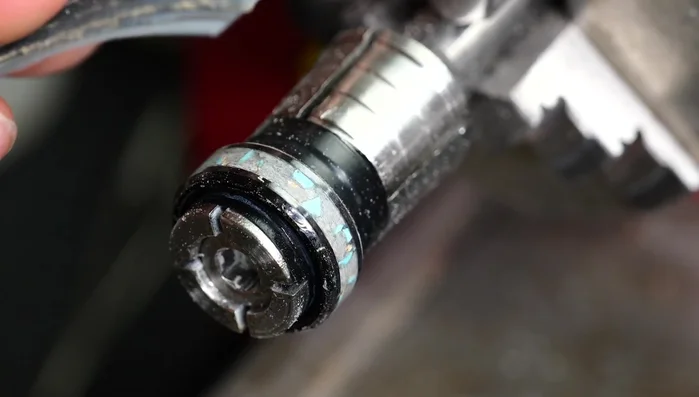 Sanding: Using sandpaper (starting with 180 grit and working up to 2500 grit), carefully sand the ring until the inlay is flush with the surface.