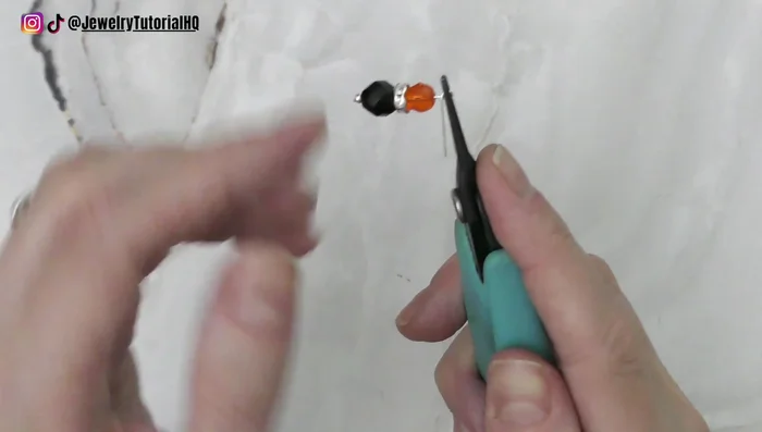 Twist the tail around a few times, trim the extra, and tuck the end down.