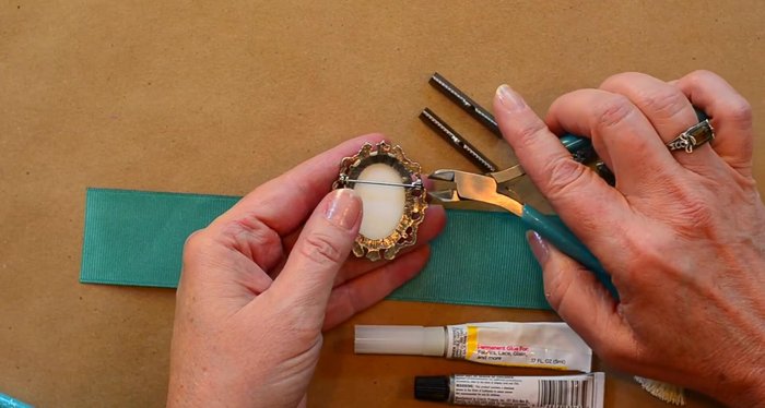 Remove pin backs from brooches and shanks from buttons using wire snips. Wear eye protection.