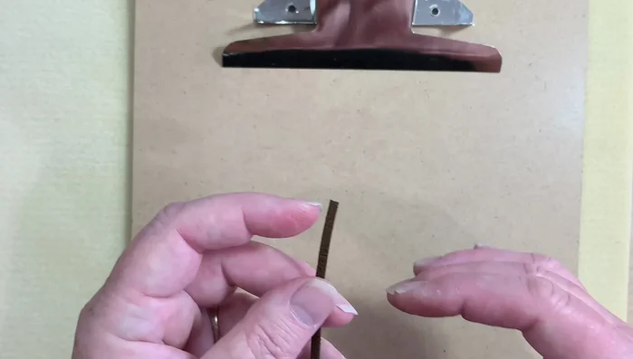 Tighten the knot, ensuring even tension on both sides.