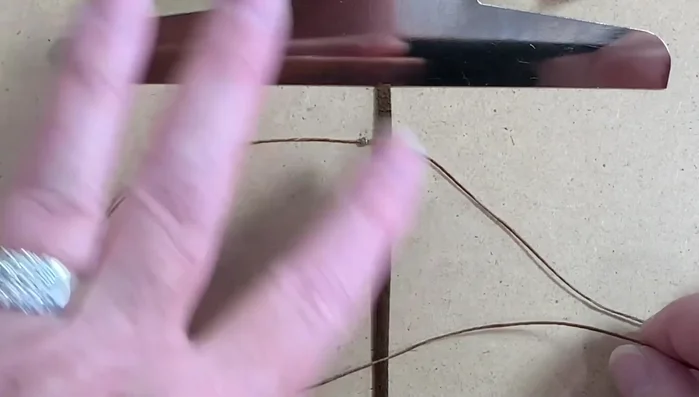 Continue adding beads and repeating the 'P' and 'Q' macrame pattern until desired length is reached. Maintain even spacing of beads and chain.