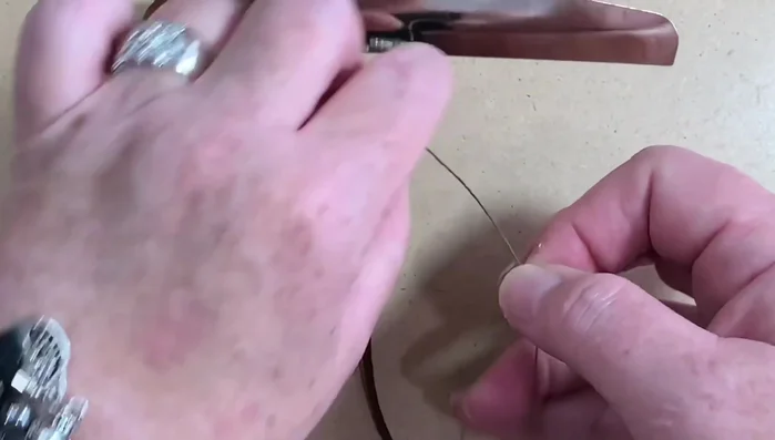 Continue adding beads and repeating the 'P' and 'Q' macrame pattern until desired length is reached. Maintain even spacing of beads and chain.