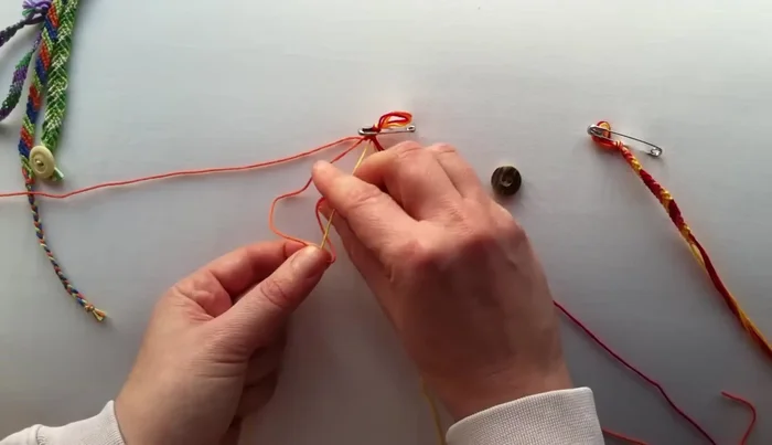 Maintain tension: Push up the knots as you go to keep the bracelet neat and tight.