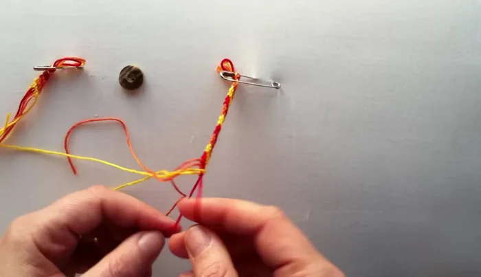 Add embellishments (optional): Tie a knot to secure the bracelet. Add a button or bead for extra flair.