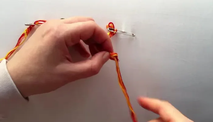 Add embellishments (optional): Tie a knot to secure the bracelet. Add a button or bead for extra flair.