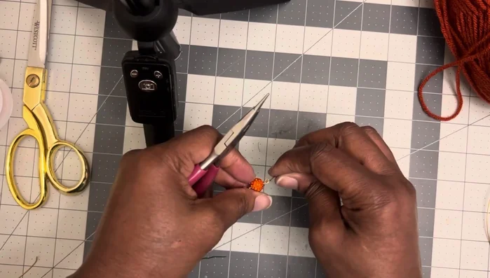 Attach the fish hook to complete the earring.