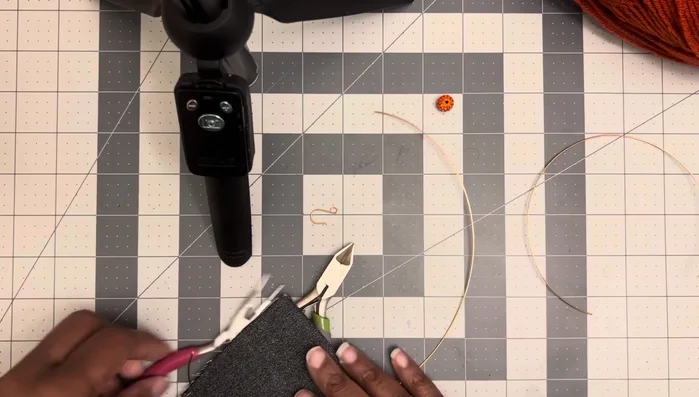 Continue wrapping the 8-inch wire tightly up towards the tip of the loop, making the loop smaller as you go.