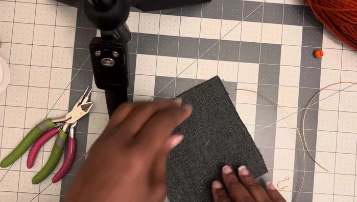 Continue wrapping the 8-inch wire tightly up towards the tip of the loop, making the loop smaller as you go.