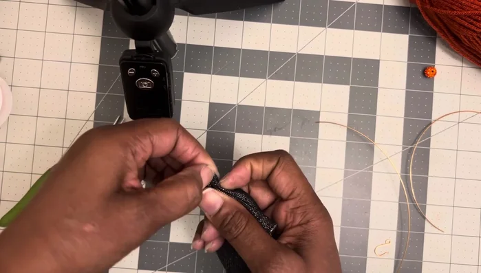 Continue wrapping the 8-inch wire tightly up towards the tip of the loop, making the loop smaller as you go.