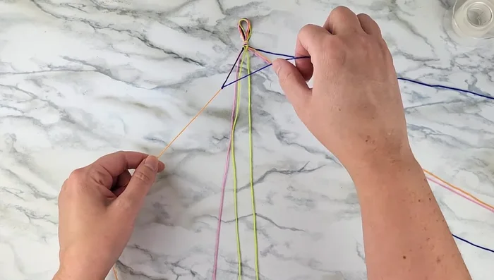 Repeat steps 4-7 with the remaining strands to continue creating the chevron pattern until the desired length is achieved.