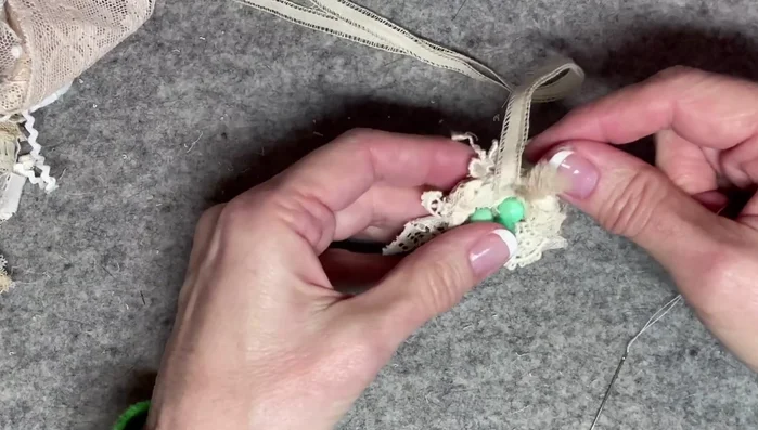 Finishing touches: Secure loose ends of thread and lace, tucking them neatly into the nest. Add a bow to the top for decoration.