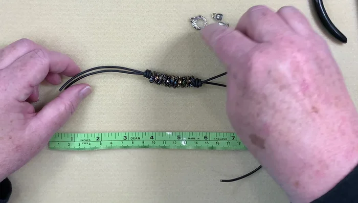 Attach the toggle clasp: Attach the toggle clasp using jump rings; using three jump rings on one side to provide extra stability.