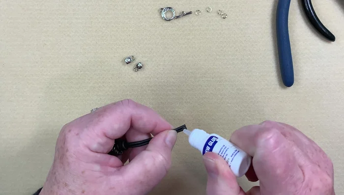 Attach the toggle clasp: Attach the toggle clasp using jump rings; using three jump rings on one side to provide extra stability.